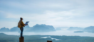 Travelers, young women are exploring the map. Landscape Beautiful Mountain on sea at Samet Nangshe Viewpoint. Phang Nga Bay ,Travel adventure, Travel Thailand, Tourist on summer holiday vacation.